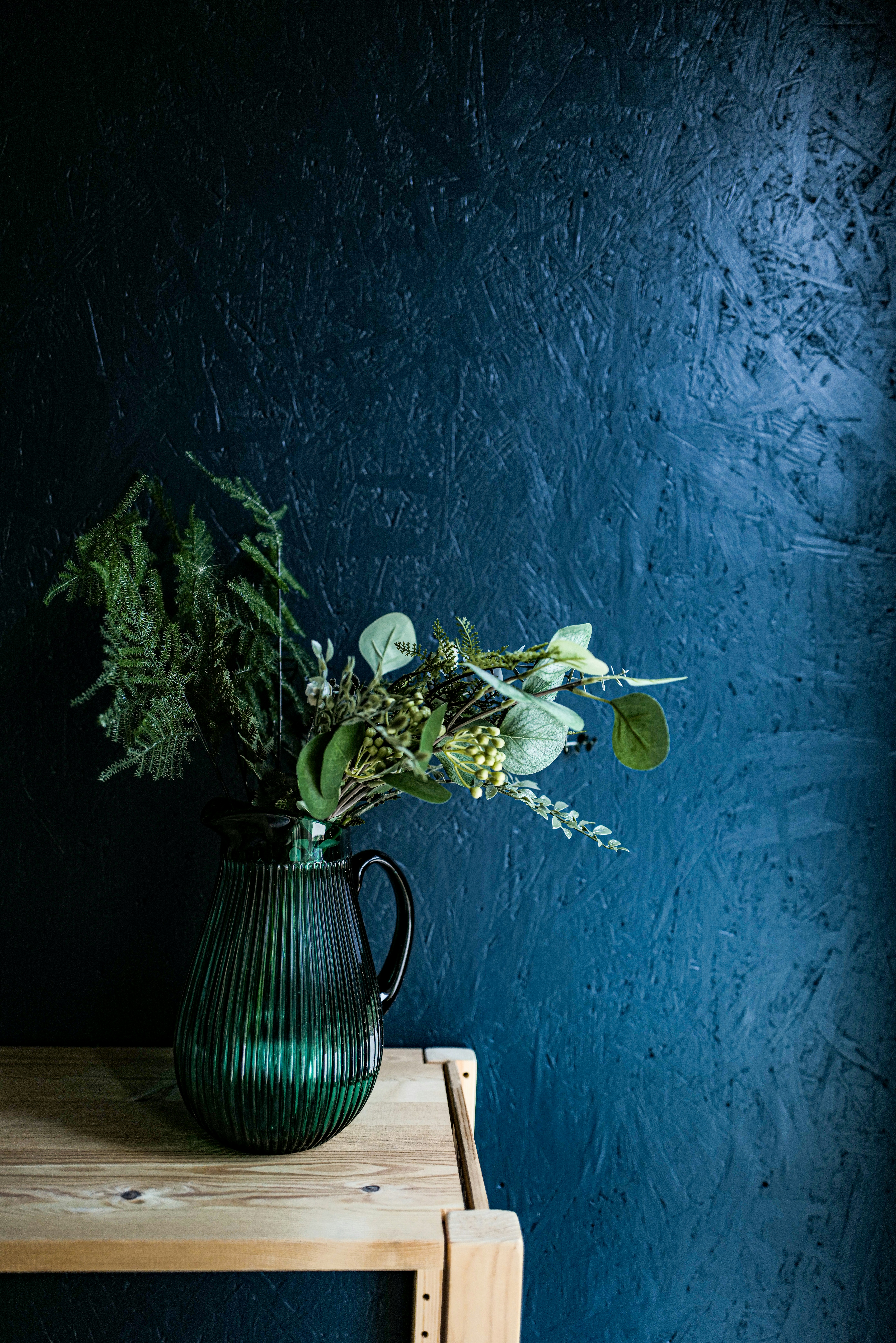 Flower near wooden blue wall